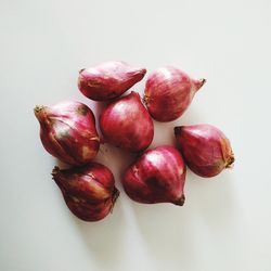 Close-up of cherries against white background