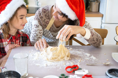 Midsection of woman preparing food on table