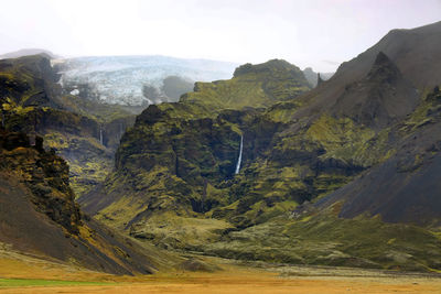 Scenic view of landscape and mountains against sky