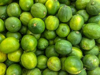 Full frame shot of green limes