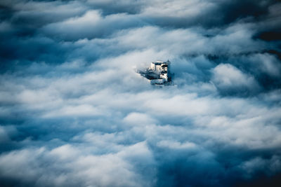 Fortress hohensalzburg rising above a sea of clouds, salzburg, austria