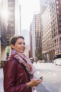 Usa, new york city, smiling woman in manhattan