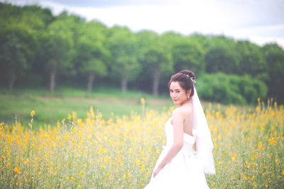 Woman standing on field