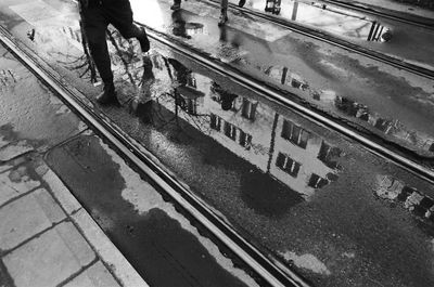 Low section of people standing on railroad tracks