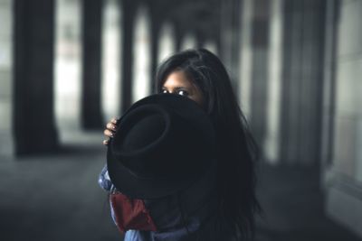 Rear view of woman photographing