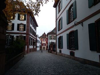 Street amidst buildings against sky