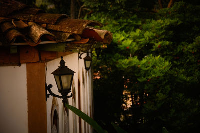 Close-up of lantern against building