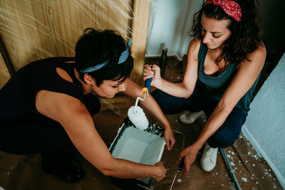 High angle view of women painting at home