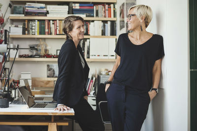 Happy industrial designers talking at home office