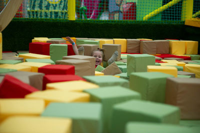 Children play a variety of games in fun room