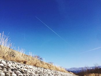 Low angle view of vapor trail in sky