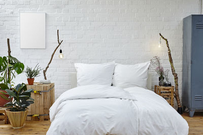 White vase on bed at home