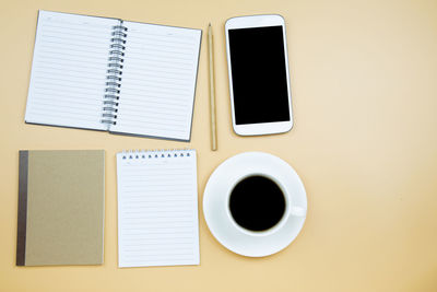 Directly above shot of coffee cup on table