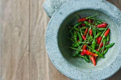 High angle view of red chili peppers in bowl