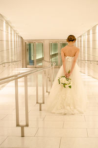 Woman standing against wall