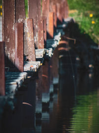 Close-up of wooden posts in river