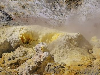 Smoke emitting from volcanic landscape