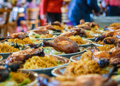 Close-up of feast with plates of food to be served for party event 