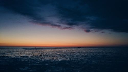 Scenic view of sea at sunset