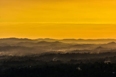 Scenic view of silhouette landscape against sky during sunset