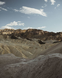 Scenic view of arid landscape against sky