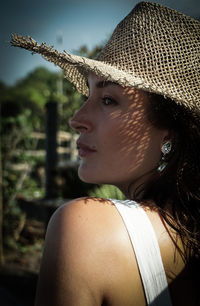 Close-up portrait of young woman looking away