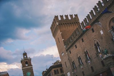 Low angle view of buildings in city against sky