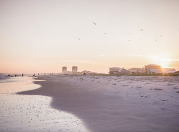 View of beach against sky during sunset