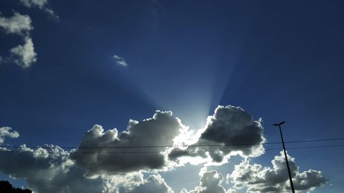 Low angle view of blue sky and clouds