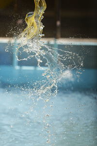 Close-up of water splashing in swimming pool