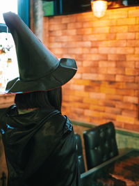 Woman wearing witch costume during halloween