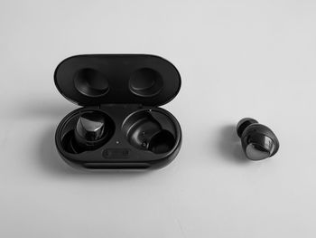 High angle view of camera on table against white background
