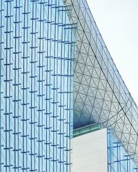 Low angle view of modern building against clear blue sky