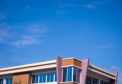 Low angle view of building against blue sky