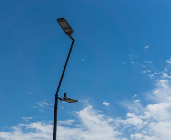 Low angle view of street light against sky
