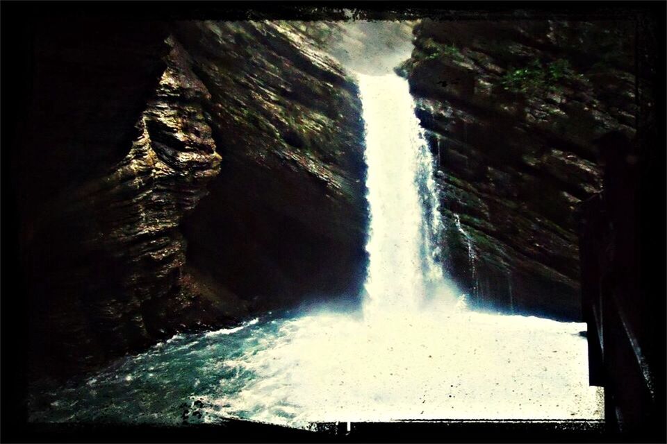 water, transfer print, rock - object, auto post production filter, waterfall, rock formation, motion, nature, beauty in nature, scenics, flowing water, surf, rock, day, river, sky, tranquil scene, tranquility, outdoors, flowing