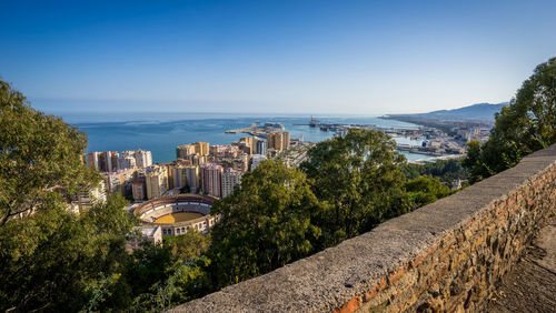 Panoramic shot of buildings and sea against clear blue sky