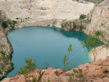 High angle view of lake amidst rock formation