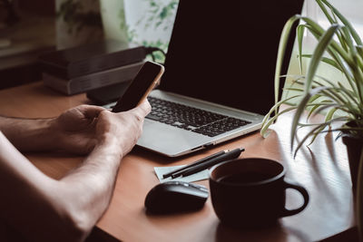 Man using laptop on table