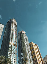 Low angle view of modern buildings against sky