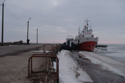 Nautical vessel on sea against sky during winter