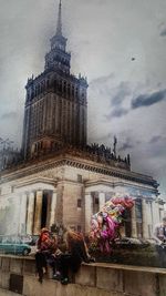 Low angle view of historic building against cloudy sky