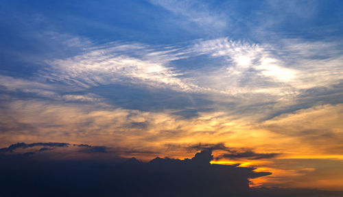 Low angle view of silhouette buildings against sky during sunset