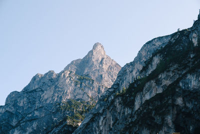 Low angle view of rock formation against clear sky