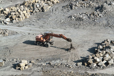 People working on rocks at construction site