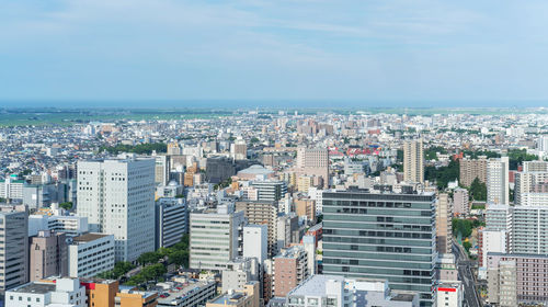 High angle view of buildings against sky in city