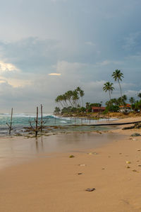 Scenic view of beach against sky