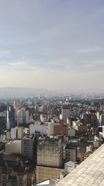 High angle view of buildings in city against sky