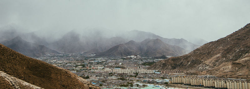 View of townscape against mountain range