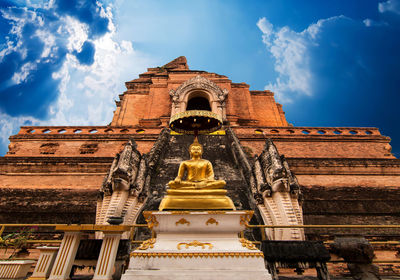 Low angle view of statue of building against sky